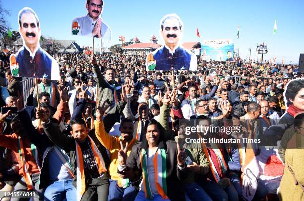 Congress party workers raising slogans and celebrating during the oath taking ceremony at Ridge, on December 11, 2022 in Shimla, India. Congresss...