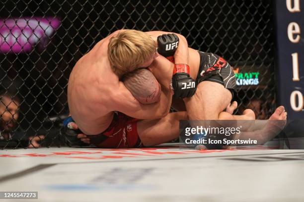 Paddy Pimblett battcontrols the body ofles Jared Gordon in their Lightweight fight during the UFC 282 event at T-Mobile Arena on December 10, 2022 in...