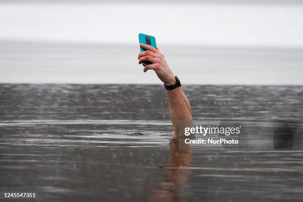 Walruses or 'Morsy' as they are called in Polish are seen swimming in a lake in Warsaw, Poland on 11 December, 2022. A snow storm lasting at least...