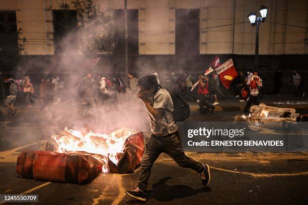 Supporters of former President Pedro Castillo clash with riot police during a demonstration demanding his release and the closure of the Peruvian...