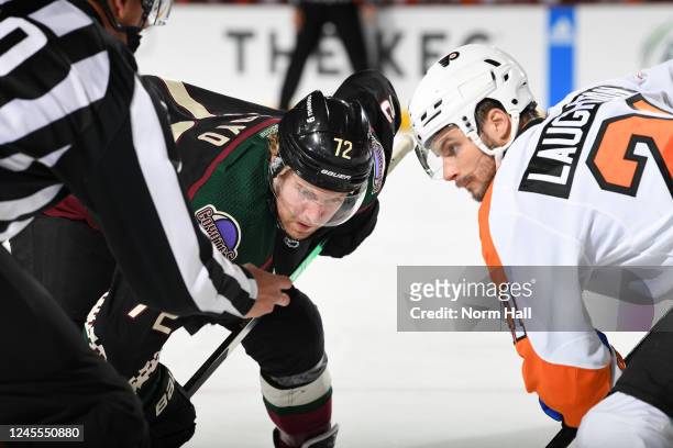 Travis Laughton of the Philadelphia Flyers lines up for a face-off against Travis Boyd of the Arizona Coyotes during the first period at Mullett...
