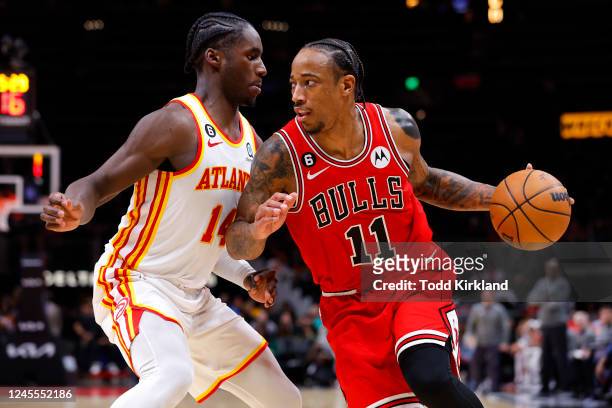 DeMar DeRozan of the Chicago Bulls drives against AJ Griffin of the Atlanta Hawks during the second half at State Farm Arena on December 11, 2022 in...