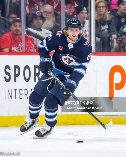 Kyle Connor of the Winnipeg Jets plays the puck up the ice during second period action against the Washington Capitals at the Canada Life Centre on...