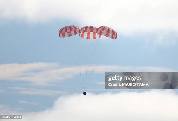 S unmanned Orion spaceship comes in for a splashdown in the Pacific Ocean off Baja California, Mexico, on December 11, 2022. - Orion was launched...