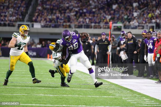 Minnesota Vikings running back Adrian Peterson is hit by Green Bay Packers free safety Ha Ha Clinton-Dix during an NFL football game between the...