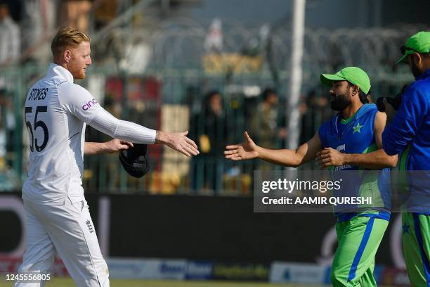 England's captain Ben Stokes shakes hands with Pakistan's Mohammad Rizwan after England's victory at the end of second cricket Test match between...