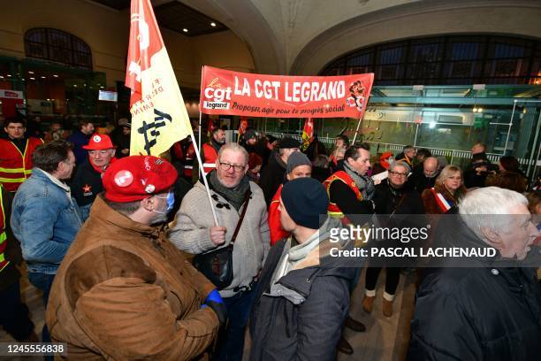 Business leaders, trade unions members and local politicians gather at Limoges train station, southwest-central France on December 14, 2022 to...