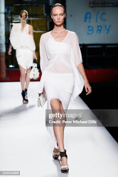 Model walks the runway at the Helmut Lang Spring 2012 fashion show during Mercedes-Benz Fashion Week at Hudson River Park's Pier 57 on September 10,...