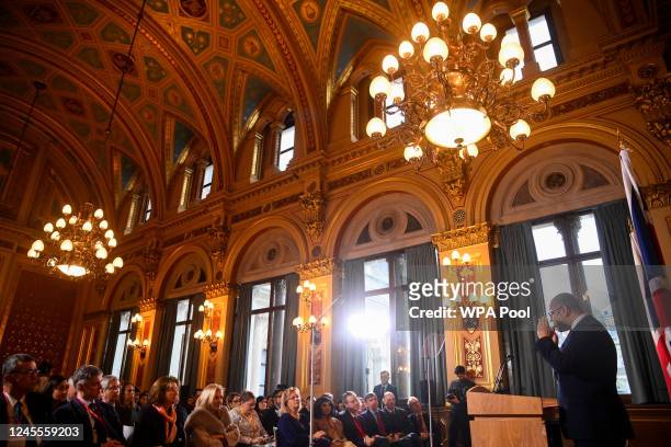 Foreign Secretary James Cleverly speaks to members of the press at the Foreign & Commonwealth Office on December 12, 2022 in London, England. The...