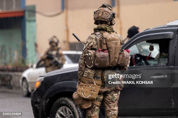 Taliban security forces arrive at the site of an attack at Shahr-e-naw which is city's one of main commercial areas in Kabul on December 12, 2022. -...