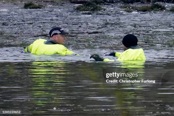 Emergency workers continue the search for further victims after a number of children fell through ice on a lake, on December 12, 2022 at Babbs Mill...