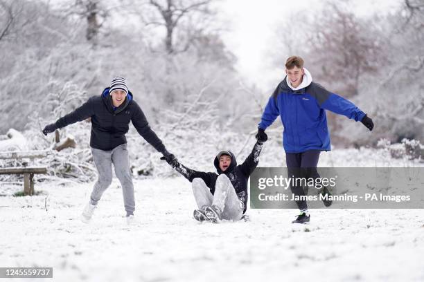 People sledging in Richmond Park in south west London. Snow and ice have swept across parts of the UK, with cold wintry conditions set to continue...