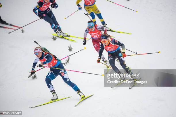 Suvi Minkkinen of Finland, Anna Weidel of Germany in action competes during the Women 4x6 km Relay at the BMW IBU World Cup Biathlon Hochfilzen on...