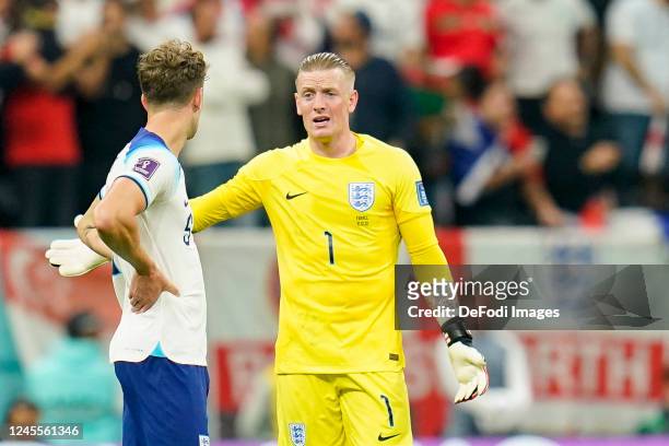 John Stones of England and goalkeeper Jordan Pickford of England looks dejected during the FIFA World Cup Qatar 2022 quarter final match between...