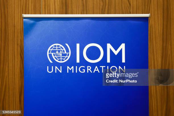 International Organization for Migration logo is seen during the job fair, organized mainly for Ukrainian refugees, in Krakow, Poland on December 8,...