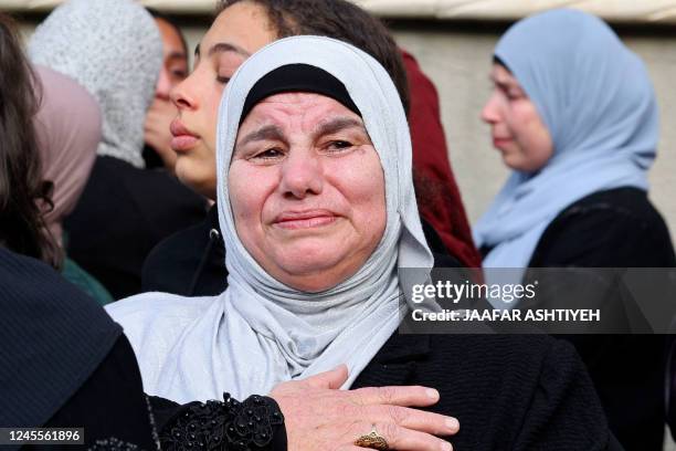 Palestinian mourners react during the funeral of 16-year-old Jana Zakarnaa, who was killed during an Israeli raid in the occupied West Bank, on...