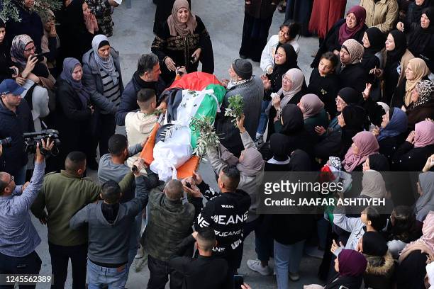 Palestinian mourners attend the funeral of 16-year-old Jana Zakarnaa, who was killed during an Israeli raid in the occupied West Bank, on December...