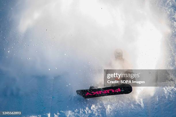 Nicolas Huber wipes out on his second qualifying run during the Style Experience Snowboard Big Air World Cup competition at the Commonwealth Stadium.