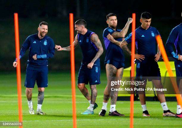 Argentina's Lionel Messi and Rodrigo Paul De during a training session at Qatar University Training Site 3 in Doha, Qatar. Picture date: Monday...