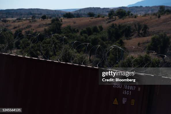 Razor Infested Containers Razor wire on top of shipping containers lining the US and Mexico ...