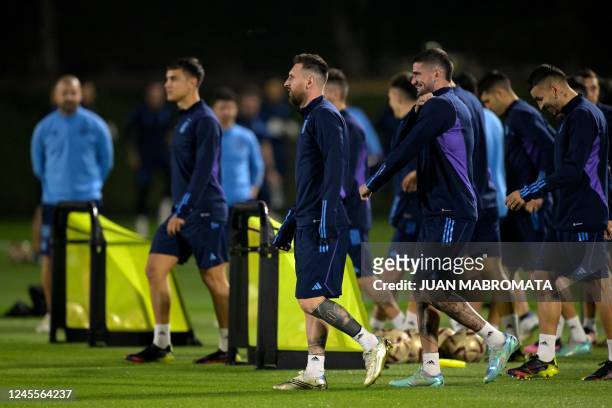 Argentina's forward Lionel Messi and teammates take part in a training session at Qatar University in Doha on December 12 on the eve of the Qatar...