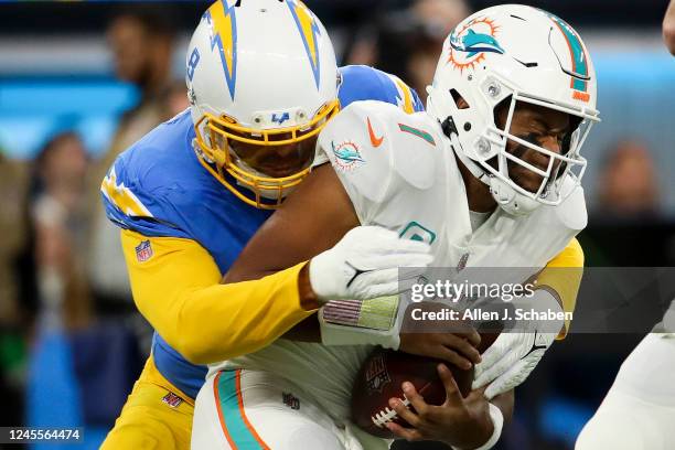 Los Angeles, CA Los Angeles Chargers linebacker Kyle Van Noy, left, sacks Miami Dolphins quarterback Tua Tagovailoa during the first half at SoFi...