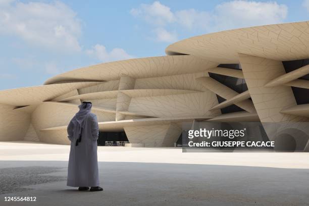 Man stands outside the National Museum of Qatar designed by French architect Jean Nouvel, in Doha on December 12 during the Qatar 2022 World Cup...