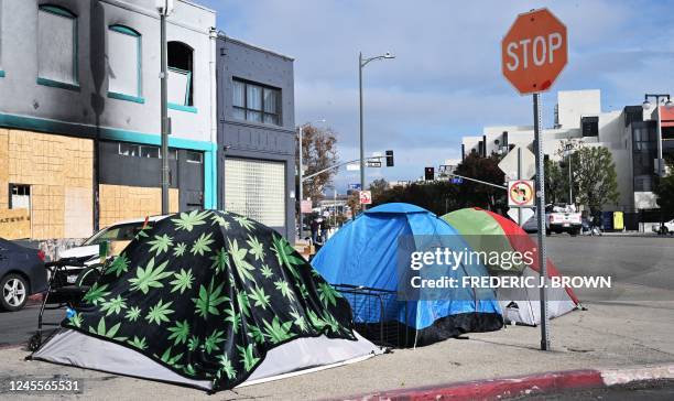 Tents for the homeless line a street corner in Los Angeles, California, on December 6, 2022. - A state of emergency over spiralling levels of...