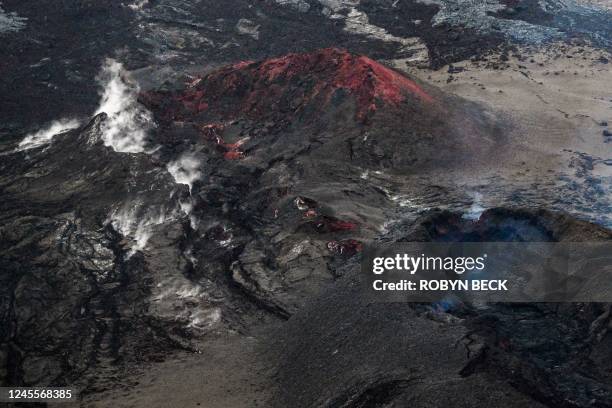 The Mauna Loa Volcano is seen from the air near Kailua-Kona, Hawaii, on December 12, 2022. - US Geological Survey announced on December 11 that Mauna...