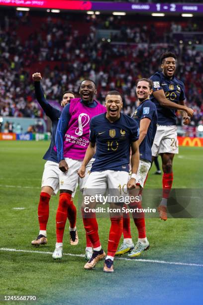 France forward Kylian Mbappe celebrates Frances win against England with teammates in the Quarterfinal match of the 2022 FIFA World Cup in Qatar...