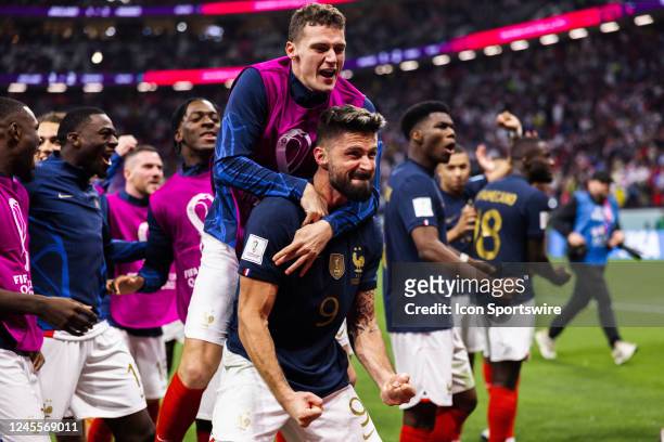 France forward Olivier Giroud celebrates Frances win with teammate in front of the fans after the Quarterfinal match of the 2022 FIFA World Cup in...