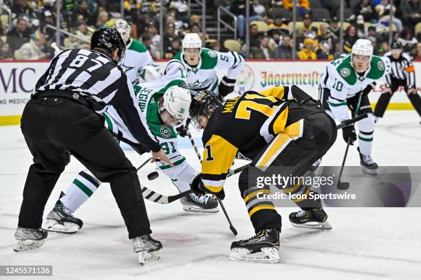 Dallas Stars Right Wing Tyler Seguin and Pittsburgh Penguins Center Evgeni Malkin face-off during the second period in the NHL game between the...