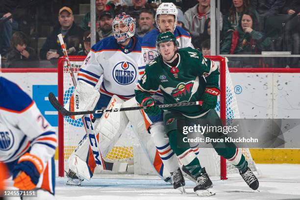 Stuart Skinner and Philip Broberg of the Edmonton Oilers defend against Sammy Walker of the Minnesota Wild during the game at the Xcel Energy Center...