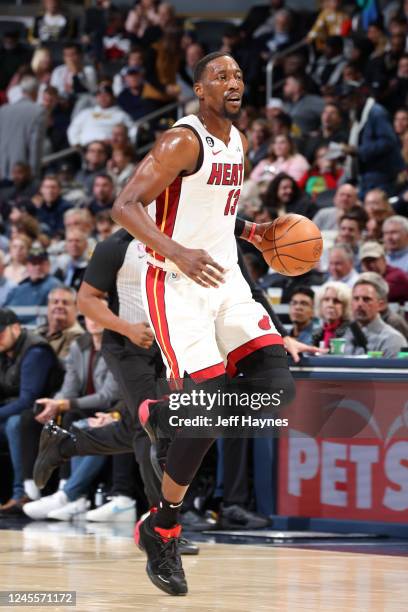 Bam Adebayo of the Miami Heat dribbles the ball during the game against the Indiana Pacers on December 12, 2022 at Gainbridge Fieldhouse in...