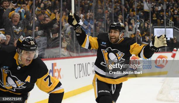 Jason Zucker of the Pittsburgh Penguins reacts after the game winning goal by Evgeni Malkin in the third period during the game against the Dallas...