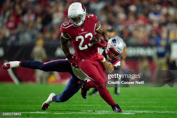 Corey Clement of the Arizona Cardinals carries the ball against the New England Patriots during the first half at State Farm Stadium on December 12,...