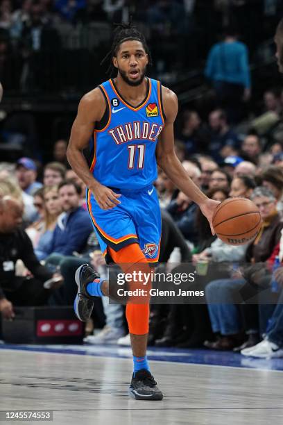 Isaiah Joe of the Oklahoma City Thunder dribbles the ball during the game against the Dallas Mavericks on December 12, 2022 at the American Airlines...