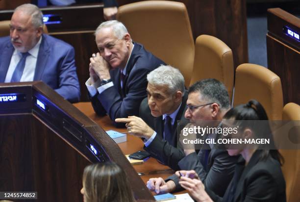 Israeli caretaker cabinet members Finance Minister Avigdor Liberman , Defence Minister Benny Gantz , Prime Minister Yair Lapid , Justice Minister...