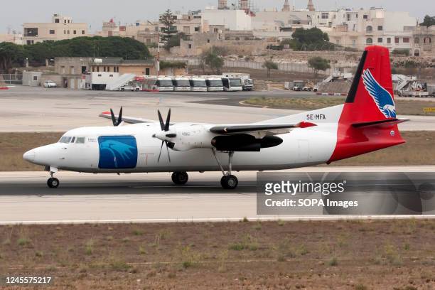 An Amapola Flyg Fokker 50 freighter on the runway of Malta international airport. Amapola Flyg is a passenger and cargo airline based in Stockholm,...
