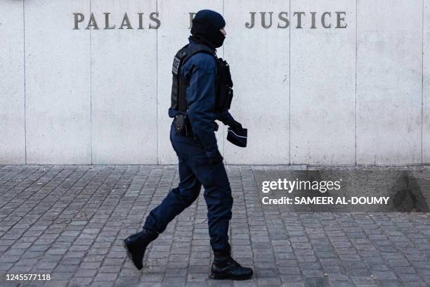 French police officer walks in front of the Court of Justice of Lille ahead the public hearing session of the member of La France Insoumise left wing...