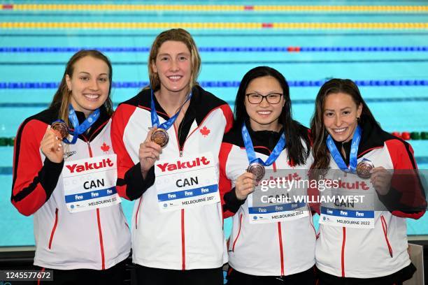 The Canadian team celebrate after winning bronze in the women's 4x100m freestyle final at the FINA World Swimming Championships 2022 in Melbourne on...