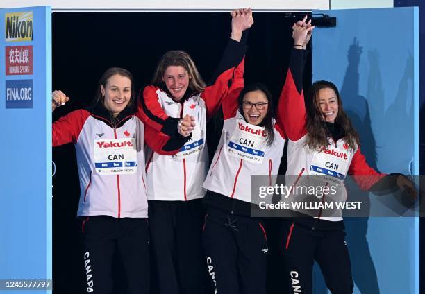 The Canadian team celebrate after winning bronze in the women's 4x100m freestyle final at the FINA World Swimming Championships 2022 in Melbourne on...