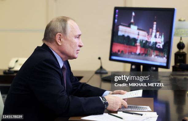 Russian President Vladimir Putin takes part via videoconference in a ceremony marking the launch of a new and renovated transport infrastructure in...