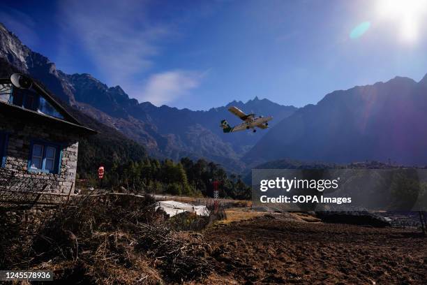 An aircraft takes flight from the runway of Tenzing-Hillary Airport, known as the world's most dangerous airport, also the gateway to the Mount...