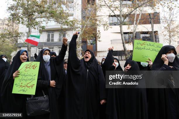 Iranian women gather during a protest outside the United Nations mission headquarters as they chant slogans in support of women's rights ahead of...