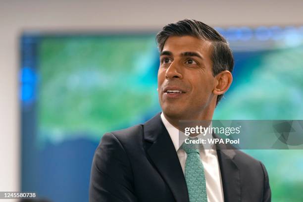 British Prime Minister Rishi Sunak speaks to Border Force officials at the Small Boats Operational Command Border Force facility on December 13, 2022...