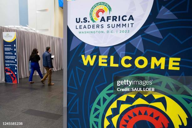 Attendees of the US-Africa Leaders Summit walk through the Walter E. Washington Convention Center, the site of the summit that brings together...