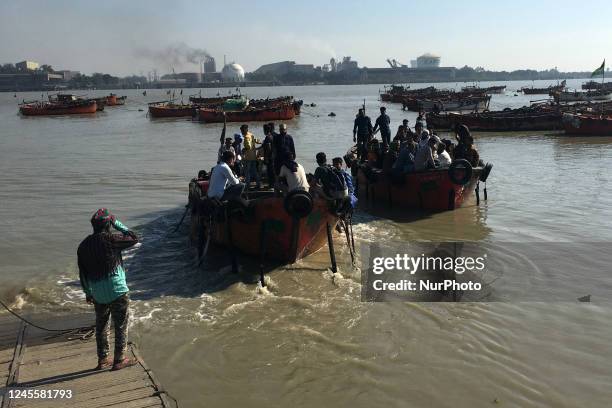 People Cross the river karnaphuli by boat near the Potenga sea beach area in Chittagong, Bangladesh on November 26, 2022.