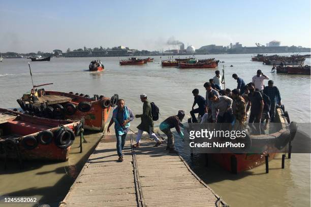 People Cross the river karnaphuli by boat near the Potenga sea beach area in Chittagong, Bangladesh on November 26, 2022.