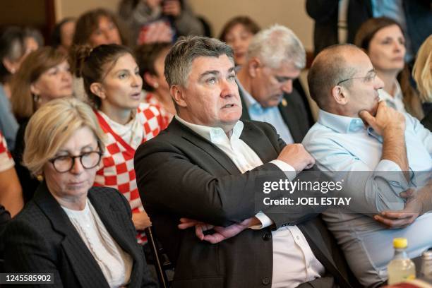 Croatian President Zoran Milanovic reacts while watching the live broadcast of the Qatar 2022 World Cup semi-final football match between Argentina...